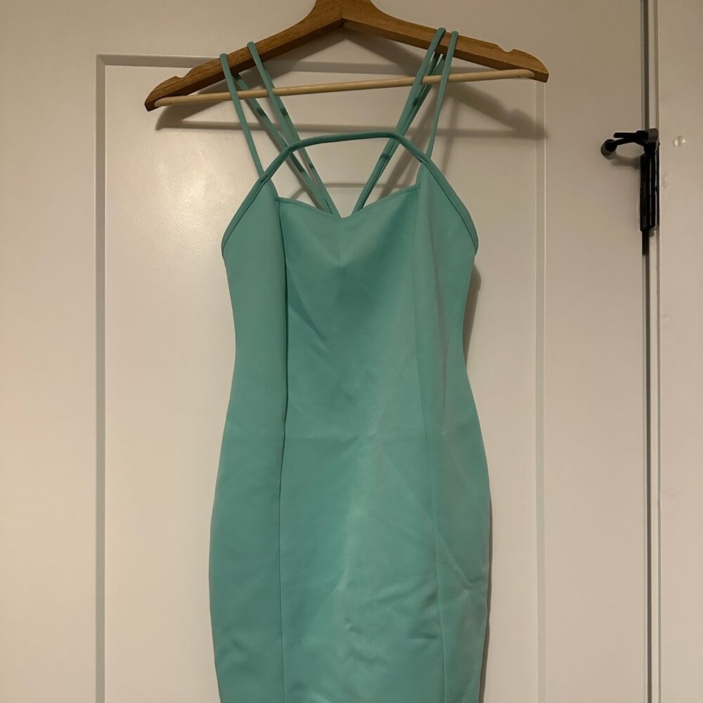 Boutique bodycon teal dress w/ geometrically designed straps